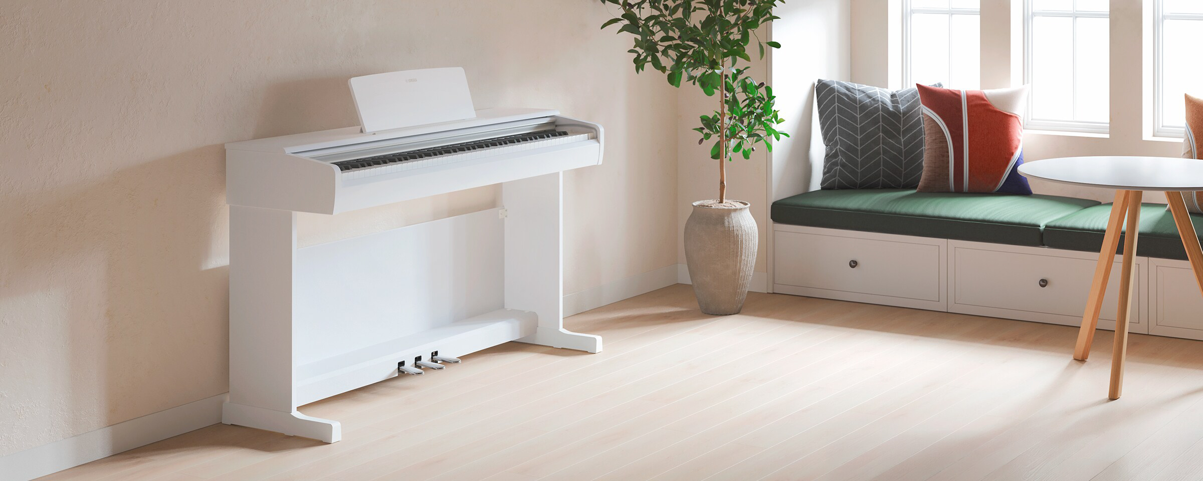 yamaha ydp-146r yamaha ydp-146wh 4 - mustore white upright piano in a bright, minimalist living space with a tall potted plant and a cushioned window seat nearby. - mustore