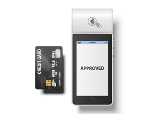 Credit card beside a mobile payment terminal displaying APPROVED, indicating a completed contactless payment.