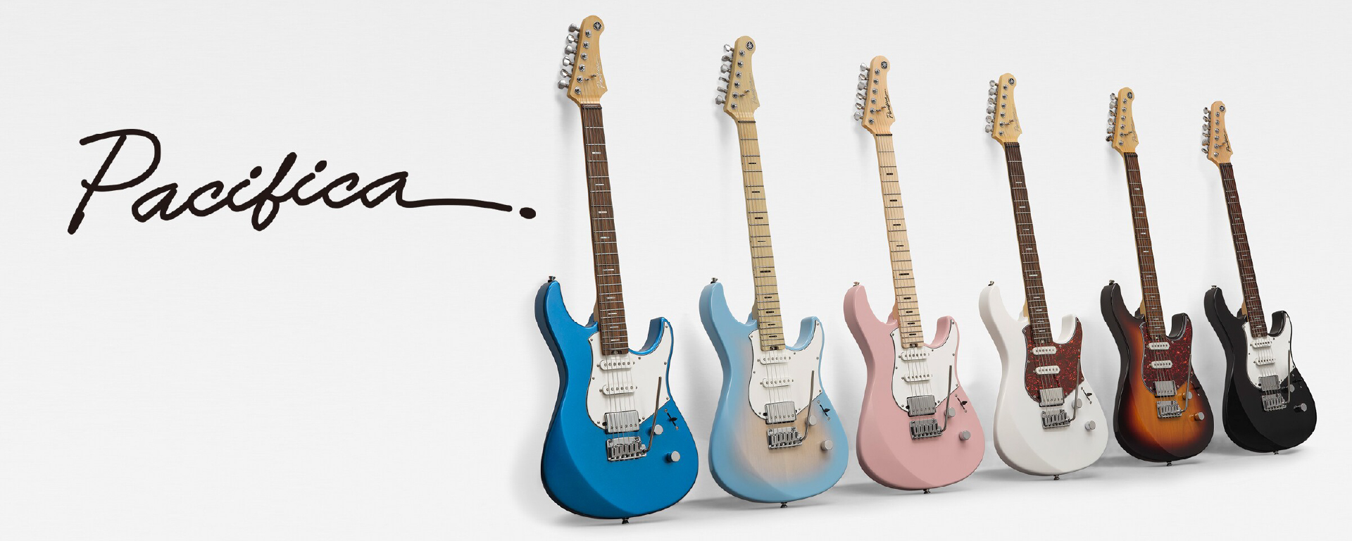Row of six Pacifica electric guitars in blue, light blue, pink, white, sunburst, and black against a white wall with the 'Pacifica' logo on the left.